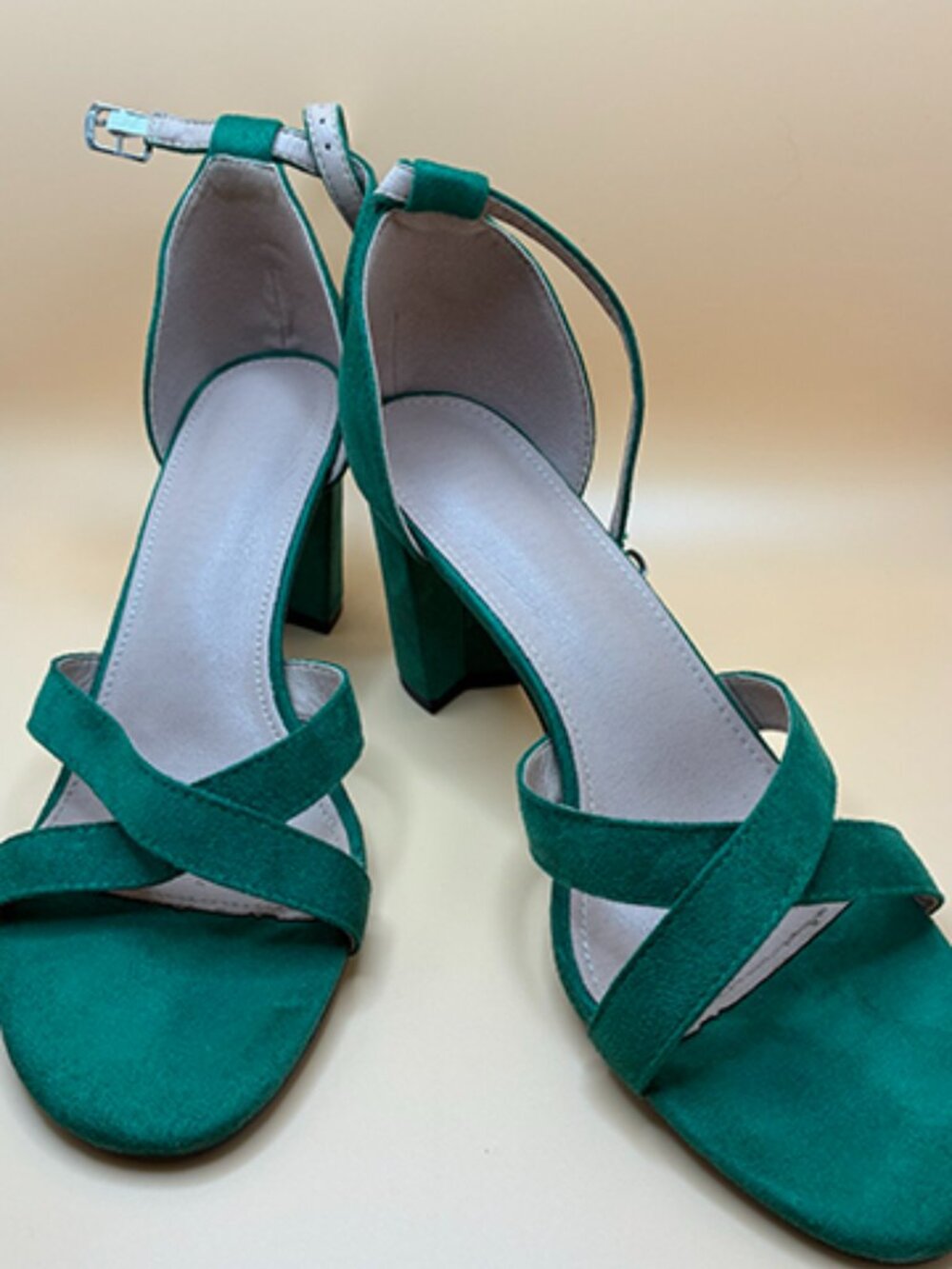 Green wide-heeled sandals with crisscross straps